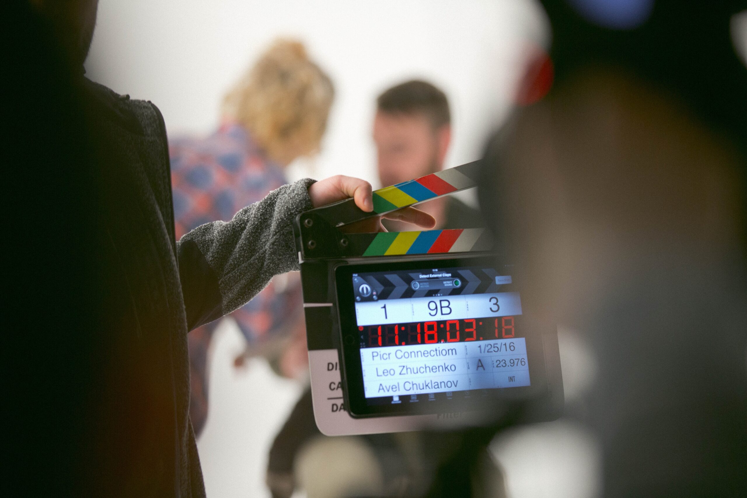 Photo, hands holding a Clapperboard