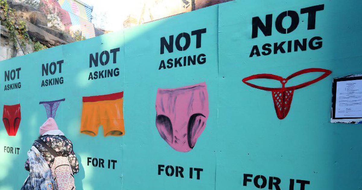 stencils on the wall, different shapes and sizes of underwear, each with the caption "Not asking for it"