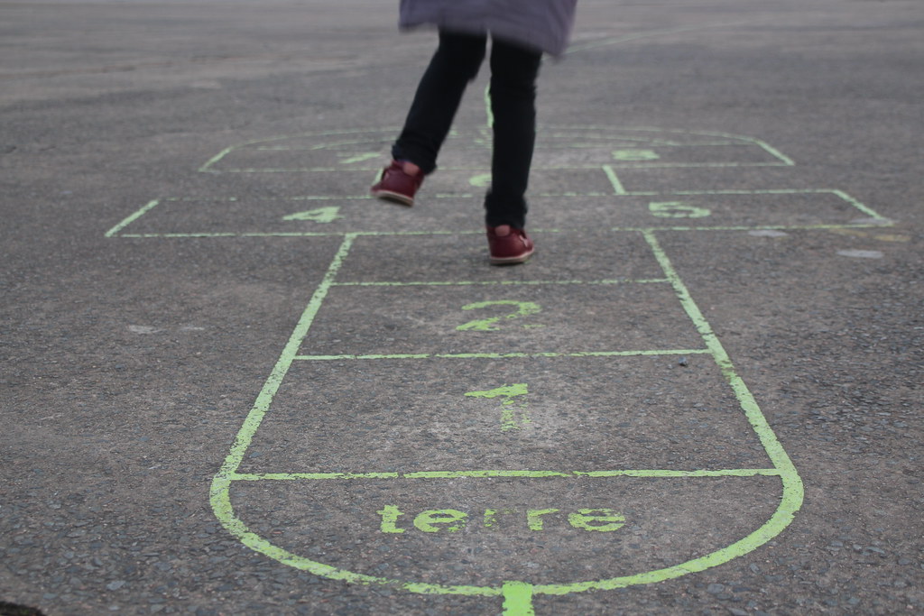 a child plays on the street