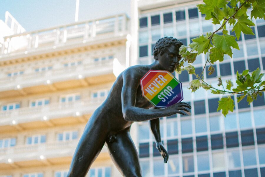 Statue in the city with a placard for Loatki rights