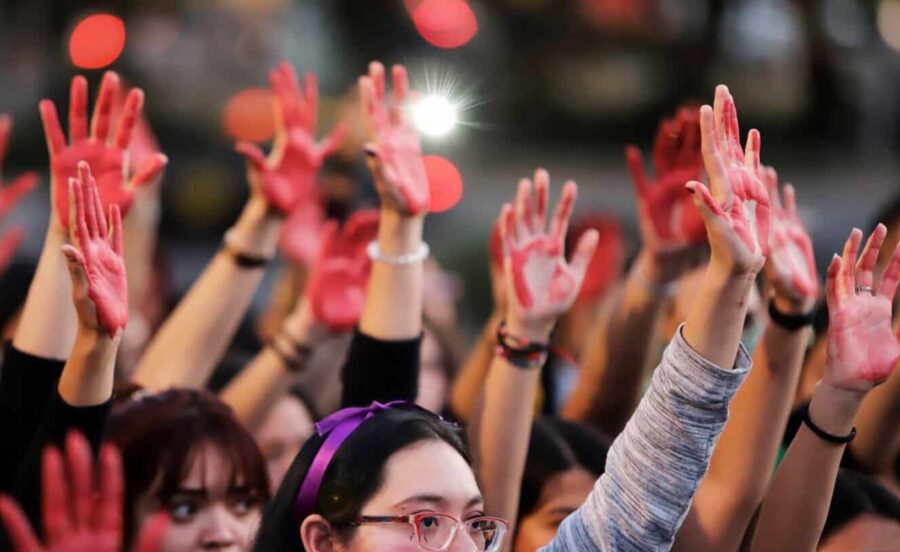 Women's hands, painted red