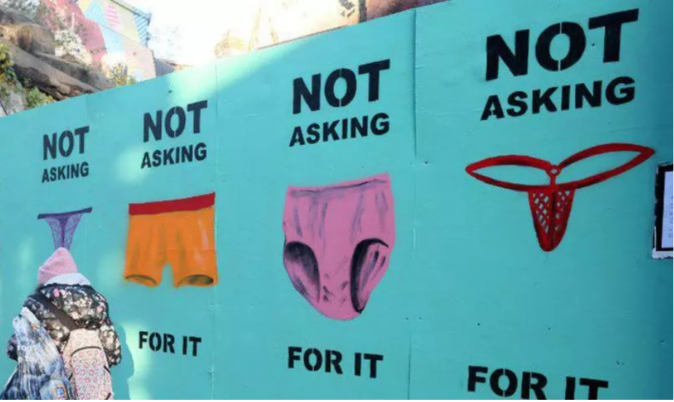 graffiti of various lingerie bottoms stating "not asking for it"